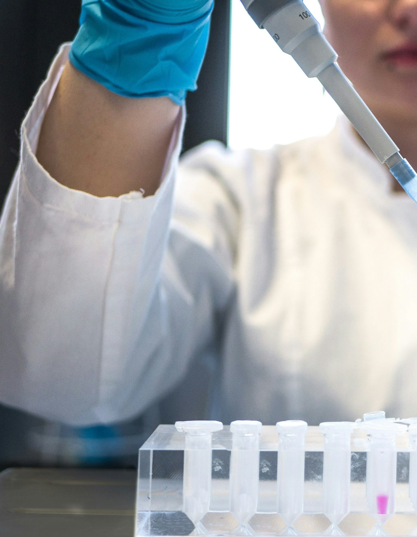 A scientist working at a laboratory bench.